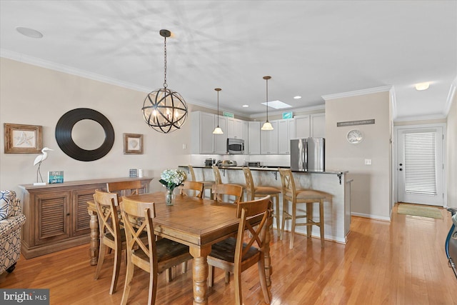 38336 Ocean Vista Dr Unit 1098, Selbyville, DE 19975 - dining space with ornamental molding, light wood-type flooring, recessed lighting, and a chandelier