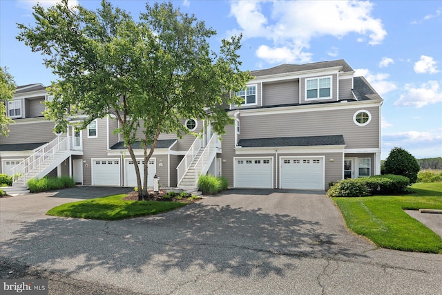 38336 Ocean Vista Dr Unit 1098, Selbyville, DE 19975 - view of front of house with stairs, asphalt driveway, and a garage