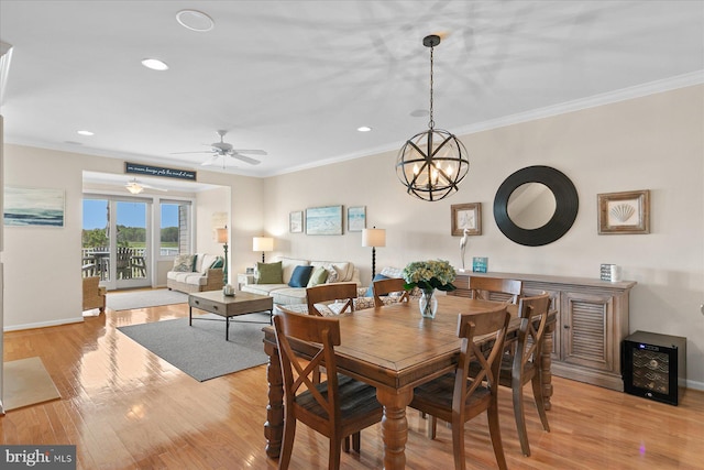 38336 Ocean Vista Dr Unit 1098, Selbyville, DE 19975 - dining room with ornamental molding, light wood-style flooring, recessed lighting, ceiling fan, and a chandelier