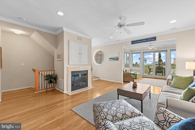 38336 Ocean Vista Dr Unit 1098, Selbyville, DE 19975 - living area featuring a ceiling fan, light wood finished floors, ornamental molding, recessed lighting, and a fireplace