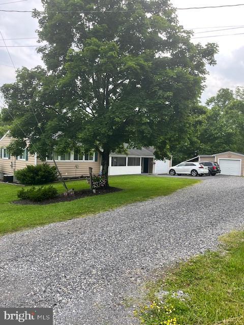 97 Dolan Heights Rd, Mifflintown, PA 17059 - obstructed view of property featuring a front yard and gravel driveway