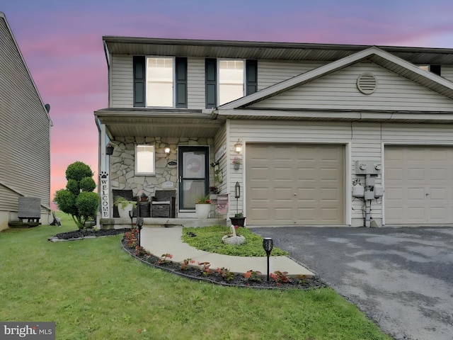 2 Marsha Dr, Cressona, PA 17929 - view of front of property featuring driveway, stone siding, a front yard, a porch, and a garage