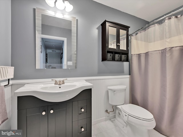 2 Marsha Dr, Cressona, PA 17929 - bathroom featuring marble look tile flooring, vanity, a wainscoted wall, and curtained shower