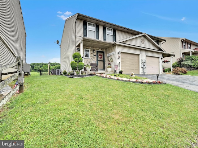 2 Marsha Dr, Cressona, PA 17929 - view of front facade with asphalt driveway, a front lawn, and an attached garage