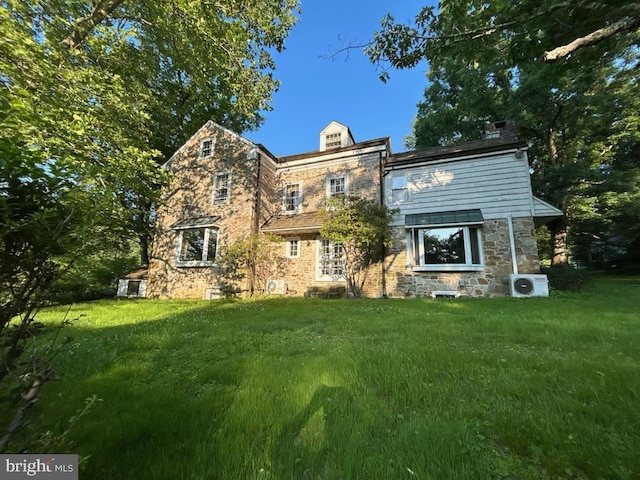 20 Constant Spring Rd, Malvern, PA 19355 - view of front facade featuring stone siding and a front yard