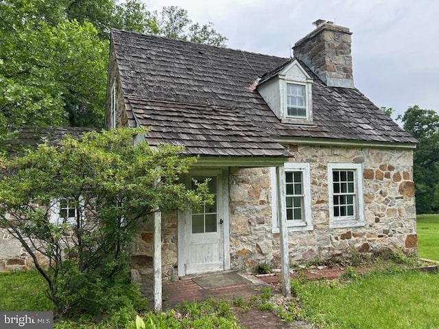 20 Constant Spring Rd, Malvern, PA 19355 - view of front of home with stone siding and a chimney