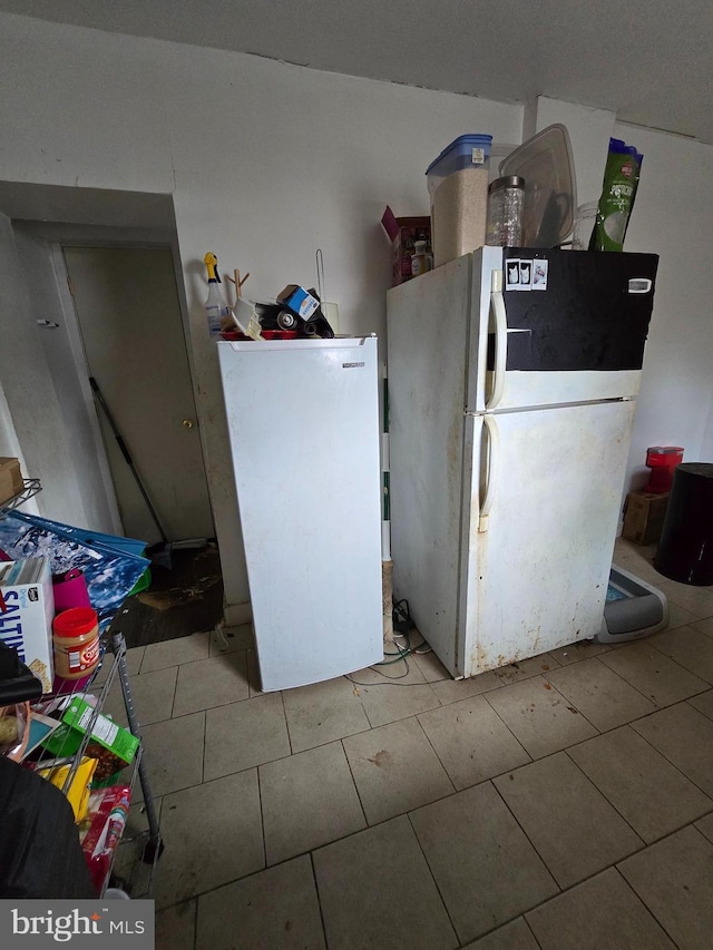 2513 W Sergeant St, Philadelphia, PA 19132 - kitchen with freestanding refrigerator and tile patterned floors