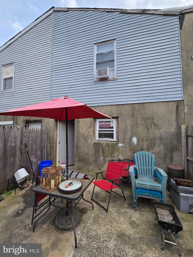 2513 W Sergeant St, Philadelphia, PA 19132 - back of house featuring a patio, cooling unit, and stucco siding