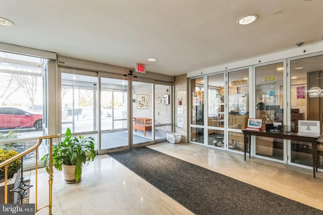 1900 Lyttonsville Rd Unit 818, Silver Spring, MD 20910 - building lobby featuring recessed lighting and a surveillance system