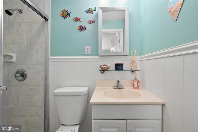 11603 Seaward Rd Unit 6, Ocean City, MD 21842 - full bathroom featuring vanity, a wainscoted wall, and tiled shower