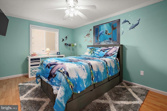 11603 Seaward Rd Unit 6, Ocean City, MD 21842 - bedroom featuring ornamental molding, wood finished floors, a textured ceiling, and a ceiling fan