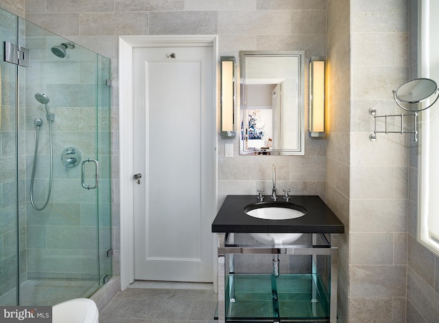 237 S 18th St Unit 20A, Philadelphia, PA 19103 - full bath with a shower stall, tile walls, and tile patterned flooring