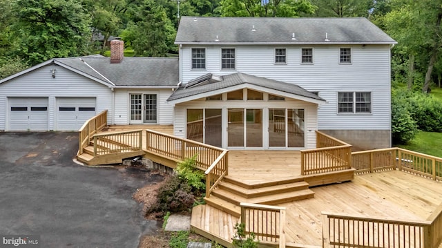 3 Lisa Ct, Elkton, MD 21921 - back of house featuring a chimney, a sunroom, roof with shingles, and a wooden deck