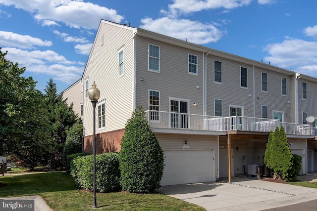 42806 Longworth Ter, Chantilly, VA 20152 - back of house featuring an attached garage and driveway