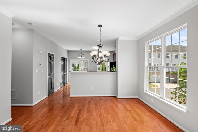 42806 Longworth Ter, Chantilly, VA 20152 - unfurnished dining area featuring a chandelier, light wood-style floors, and ornamental molding