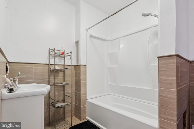 3737 N 18th St, Philadelphia, PA 19140 - full bathroom with tub / shower combination, vanity, tile walls, and a wainscoted wall