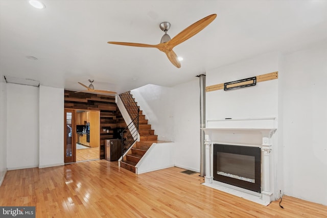 3737 N 18th St, Philadelphia, PA 19140 - unfurnished living room with a ceiling fan, a glass covered fireplace, wood finished floors, stairway, and recessed lighting
