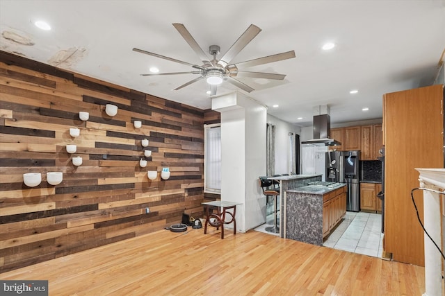 3737 N 18th St, Philadelphia, PA 19140 - kitchen with island exhaust hood, brown cabinetry, stainless steel refrigerator with ice dispenser, ceiling fan, and recessed lighting