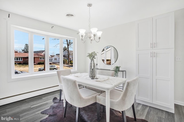 5917 Linthicum Ln, Linthicum Heights, MD 21090 - dining room with a chandelier, wood finished floors, and a baseboard radiator