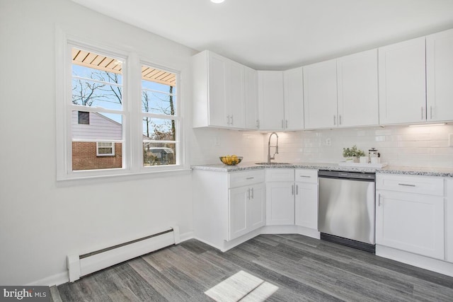 5917 Linthicum Ln, Linthicum Heights, MD 21090 - kitchen with stainless steel dishwasher, a baseboard radiator, dark wood-style floors, white cabinetry, and tasteful backsplash