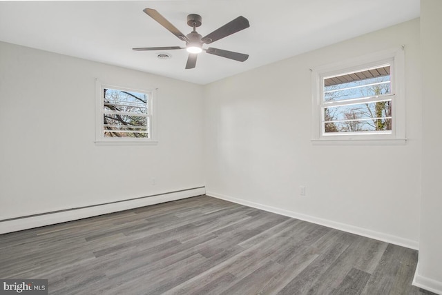 5917 Linthicum Ln, Linthicum Heights, MD 21090 - empty room with wood finished floors, a baseboard radiator, and a ceiling fan