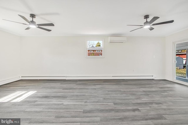 5917 Linthicum Ln, Linthicum Heights, MD 21090 - spare room with a ceiling fan, an AC wall unit, plenty of natural light, wood finished floors, and crown molding