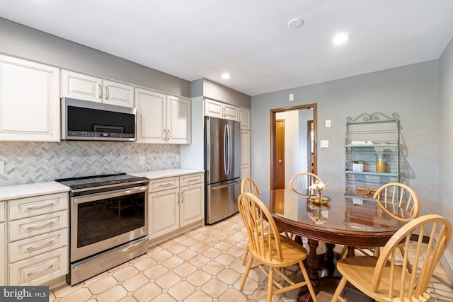 1540 Davidson Rd, Abington, PA 19001 - kitchen featuring stainless steel appliances, light countertops, decorative backsplash, recessed lighting, and white cabinets