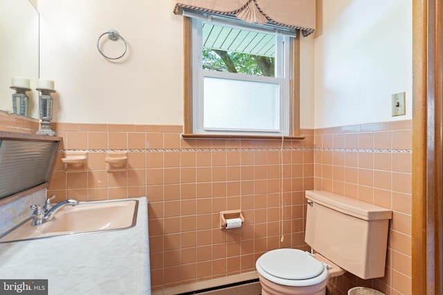 1540 Davidson Rd, Abington, PA 19001 - bathroom with tile walls, baseboard heating, vanity, and a wainscoted wall