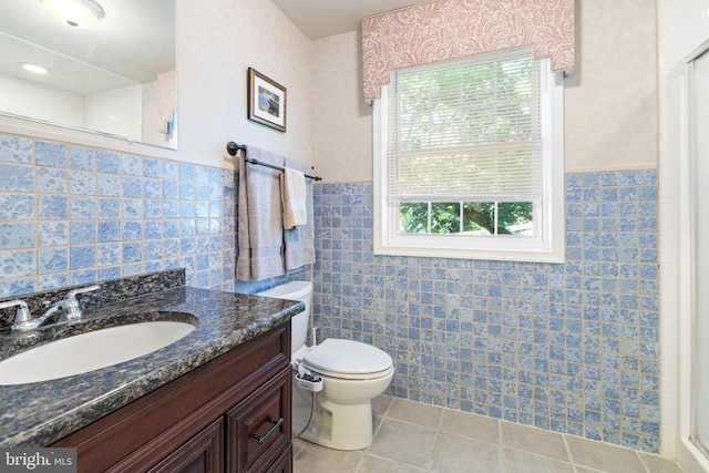 1540 Davidson Rd, Abington, PA 19001 - bathroom with tile patterned floors, tile walls, vanity, a shower, and a wainscoted wall