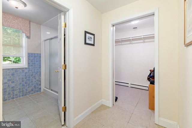 1540 Davidson Rd, Abington, PA 19001 - full bathroom featuring a baseboard radiator, tile patterned floors, a stall shower, and a spacious closet