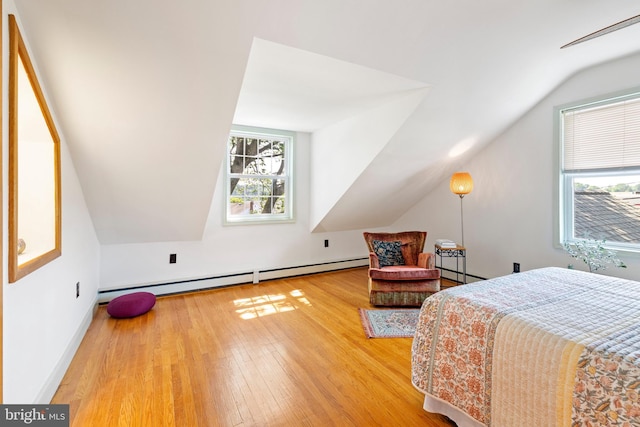 1540 Davidson Rd, Abington, PA 19001 - bedroom featuring a baseboard radiator, vaulted ceiling, and hardwood / wood-style flooring
