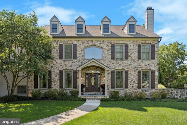 2573 Muirfield Way, Lansdale, PA 19446 - view of front of home with a front yard, stone siding, and a chimney