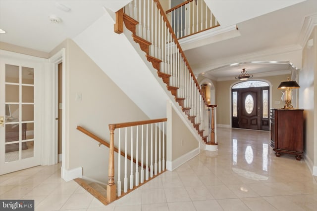 2573 Muirfield Way, Lansdale, PA 19446 - entryway featuring arched walkways, crown molding, tile patterned flooring, and stairs