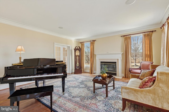 2573 Muirfield Way, Lansdale, PA 19446 - living room with ornamental molding, wood finished floors, and a glass covered fireplace