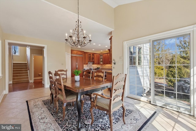 2573 Muirfield Way, Lansdale, PA 19446 - dining area with stairway, a chandelier, light tile patterned flooring, a high ceiling, and recessed lighting