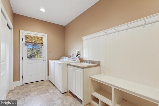 2573 Muirfield Way, Lansdale, PA 19446 - laundry room with washer and dryer, cabinet space, and stone finish flooring