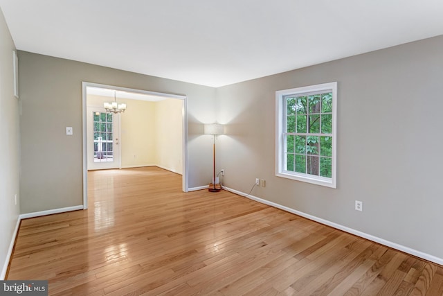 244 Marsden Heights Rd, Linden, VA 22642 - empty room with a chandelier, light wood-style flooring, and baseboards