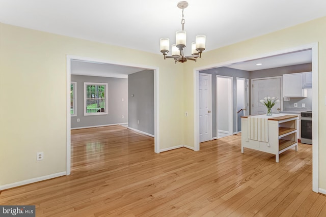 244 Marsden Heights Rd, Linden, VA 22642 - unfurnished dining area featuring a chandelier, light wood finished floors, and baseboards