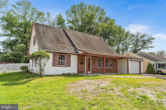 15 Excell Ln, Willingboro, NJ 08046 - view of front facade with an attached garage, driveway, covered porch, brick siding, and roof with shingles
