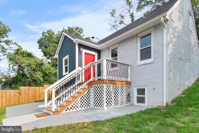 5021 A St SE, Washington, DC 20019 - rear view of property featuring a patio area and brick siding