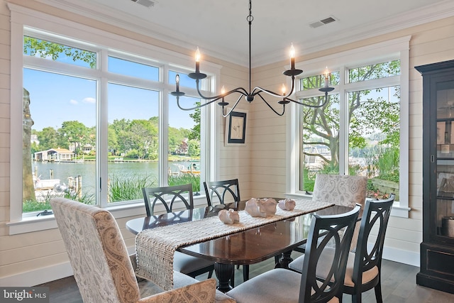16 Spa Creek Lndg, Annapolis, MD 21403 - dining space with a chandelier, crown molding, dark wood finished floors, a water view, and wood walls