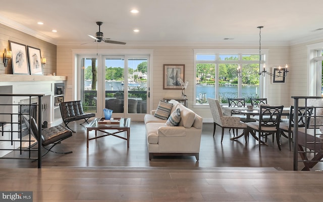 16 Spa Creek Lndg, Annapolis, MD 21403 - living room featuring ornamental molding, hardwood / wood-style floors, a chandelier, ceiling fan, and wooden walls