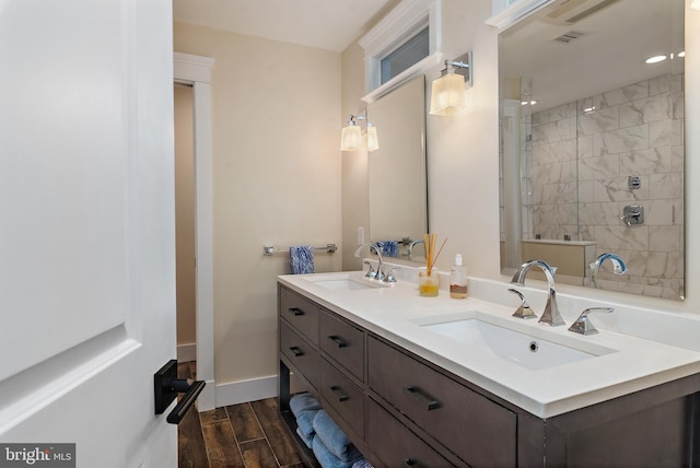 16 Spa Creek Lndg, Annapolis, MD 21403 - full bathroom featuring double vanity, wood finished floors, and a stall shower