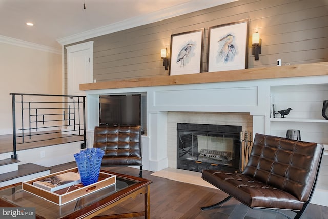 16 Spa Creek Lndg, Annapolis, MD 21403 - living area with ornamental molding, stairs, wood finished floors, a fireplace with flush hearth, and recessed lighting