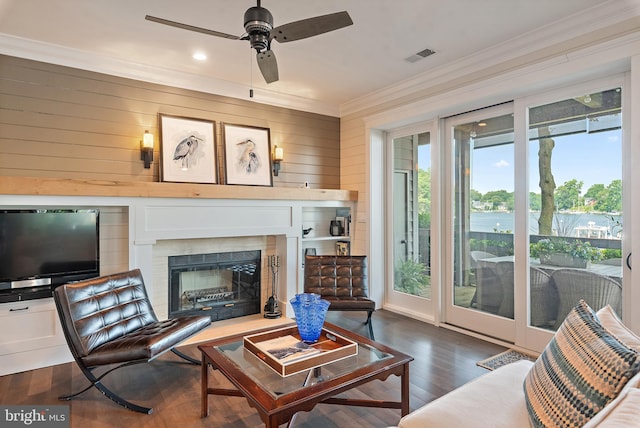 16 Spa Creek Lndg, Annapolis, MD 21403 - living room featuring crown molding, ceiling fan, wood finished floors, wooden walls, and recessed lighting