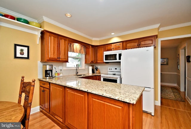 403 Grenoble Dr, Sellersville, PA 18960 - kitchen featuring white appliances, a peninsula, light wood-style flooring, light stone countertops, and brown cabinets
