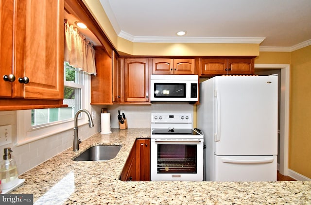 403 Grenoble Dr, Sellersville, PA 18960 - kitchen with white appliances, light stone counters, tasteful backsplash, ornamental molding, and brown cabinetry