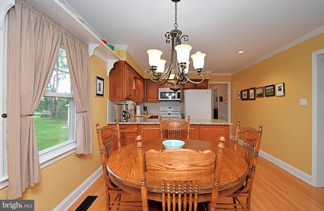 403 Grenoble Dr, Sellersville, PA 18960 - dining space with a chandelier, light wood-style floors, and crown molding