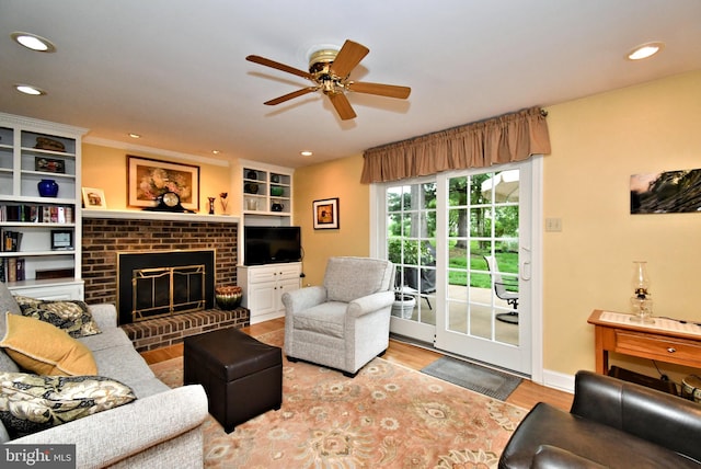 403 Grenoble Dr, Sellersville, PA 18960 - living area with a fireplace, wood finished floors, a ceiling fan, and recessed lighting
