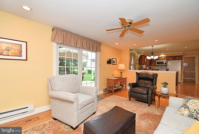 403 Grenoble Dr, Sellersville, PA 18960 - living area with a baseboard heating unit, a chandelier, light wood-type flooring, a ceiling fan, and recessed lighting